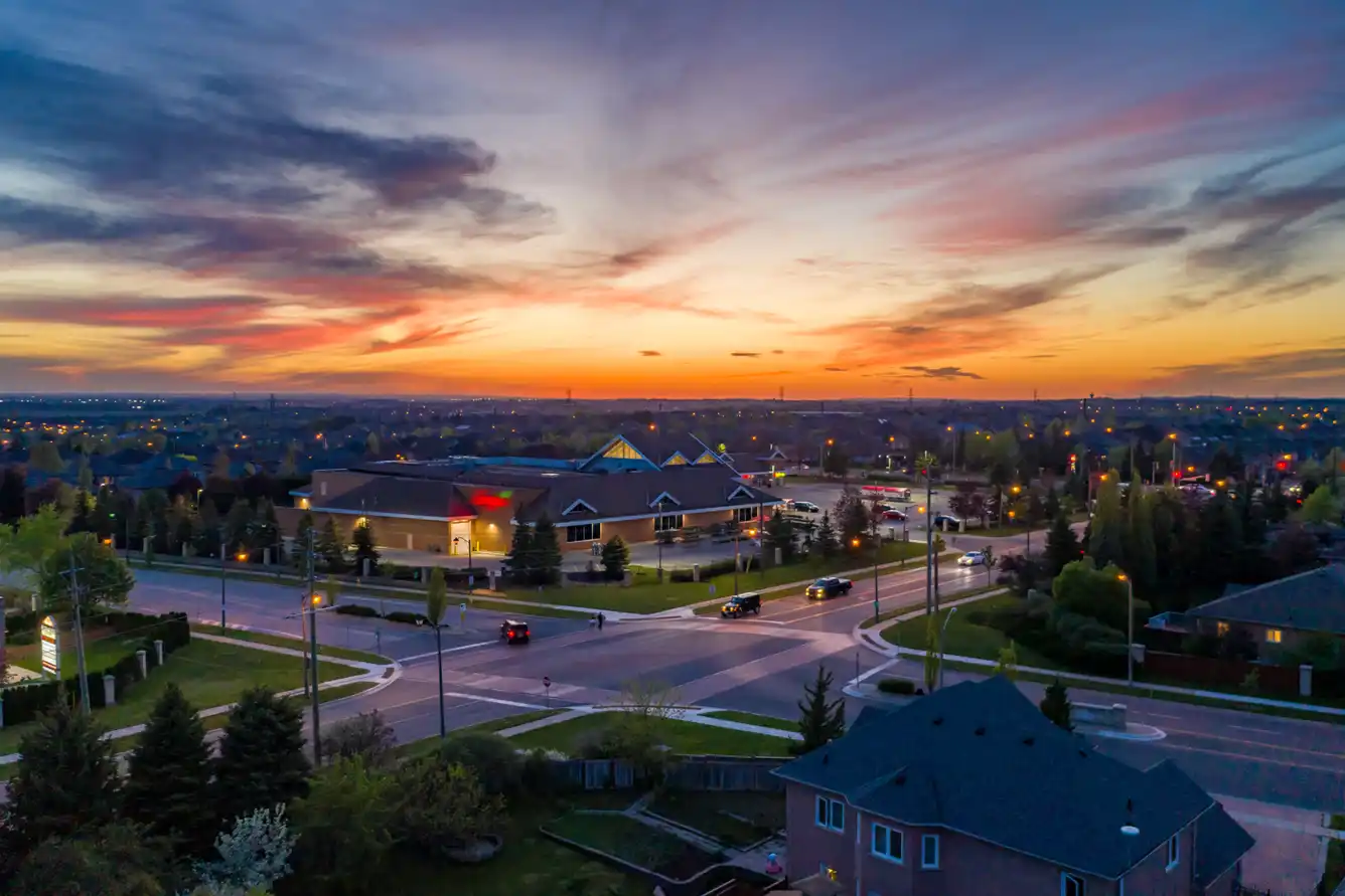 Aerial view of Rutherford Road and Islington Avenue, homes, cars, and businesses at Woodbridge in Vaughn, Ontario, Canada. As summer kicks off, remember to check your insurance coverage.