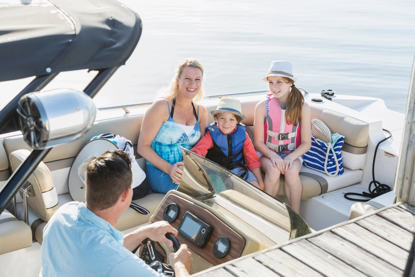 Family on a motorboat, preparing to hit the high seas.