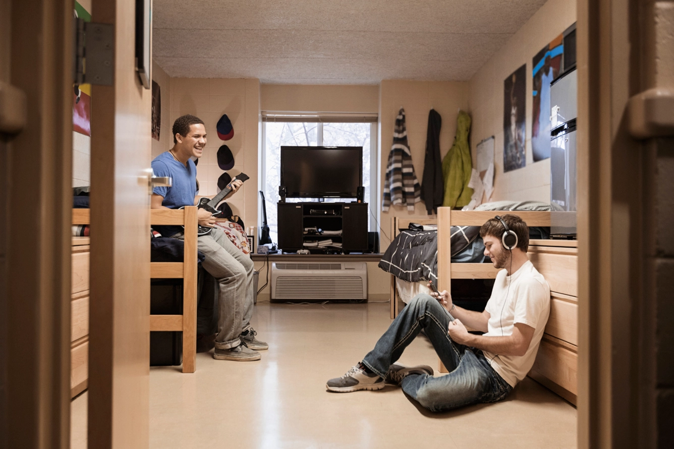 Students relaxing in dorm room.