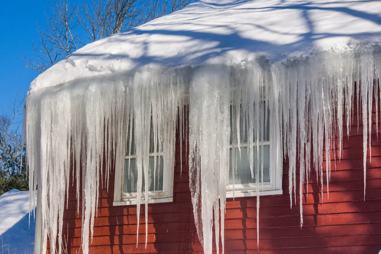 Ice dams on a roof of a house